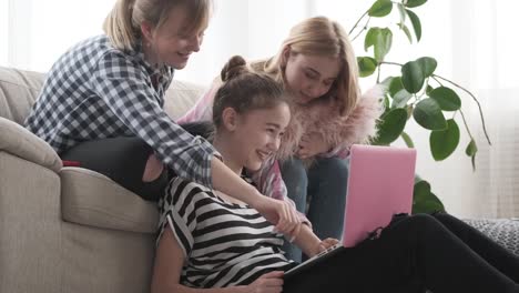 Teenage-girls-browsing-social-media-content-on-laptop