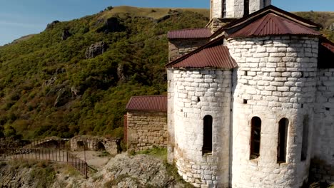 4K-UHD-Aerial-view-of-a-mountain-monastery-standing-on-a-cliff