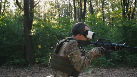 Soldier-with-rifle-wearing-virtual-reality-glasses-outdoors