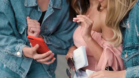 Close-up-of-the-girls'-hands-using-phone