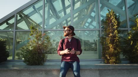 Young-Man-Using-Phone-Outdoors