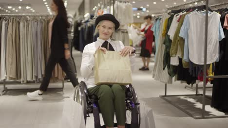 Excited-Woman-in-Wheelchair-Posing-in-Clothing-Store