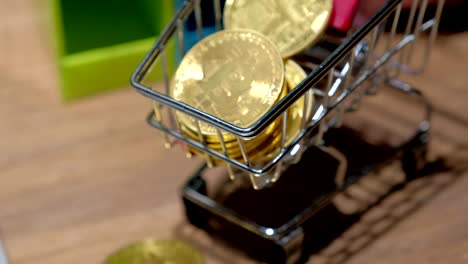 4k-slider-shot-of-Golden-bitcoins-on-business-desk.