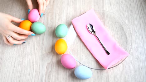 Lay-out-beautifully-colored-Easter-eggs-on-the-table.