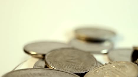 Rotated-coins-on-white-background