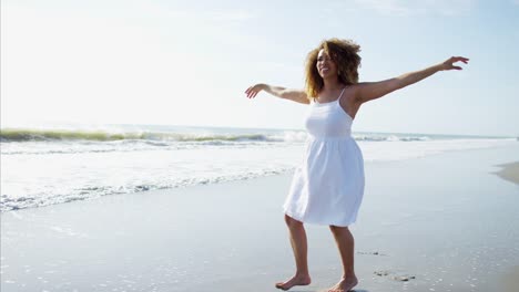 Voluptuous-African-American-female-paddling-barefoot-in-shallows