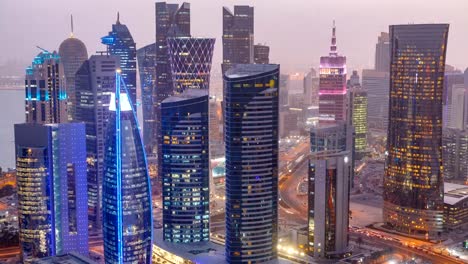 Die-Skyline-von-der-West-Bay-Area-von-oben-in-Doha-Tag-Nacht-Zeitraffer,-Katar