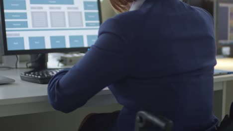 Businesswoman-in-Wheelchair-Working-on-Computer