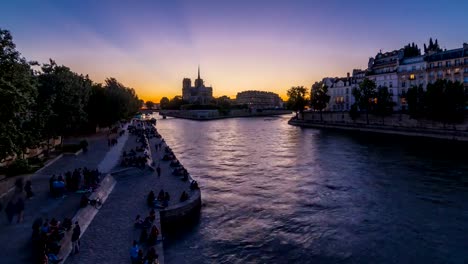 Rear-view-of-Notre-Dame-De-Paris-cathedral-day-to-night-timelapse-after-sunset