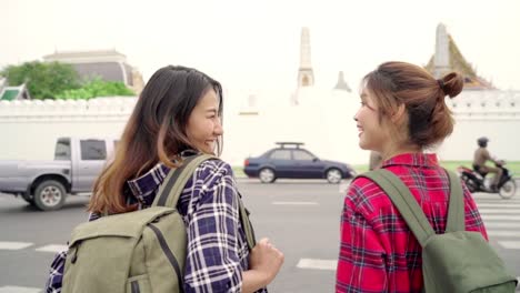 Slow-motion---Traveler-backpacker-Asian-women-lesbian-lgbt-couple-travel-in-Bangkok,-Thailand.-Happy-young-female-spending-holiday-trip-at-amazing-landmark-and-enjoy-her-journey-in-traditional-city.