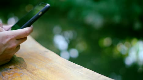 Woman-hand-using-smartphone-in--cafe-background.-Business,-financial,-trade-stock-maket-and-social-network-concept.