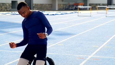 Disabled-athletic-relaxing-on-a-running-track-4k