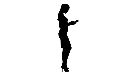 Silhouette-Beautiful-young-adult-womann-having-fun-playing-game-with-tablet