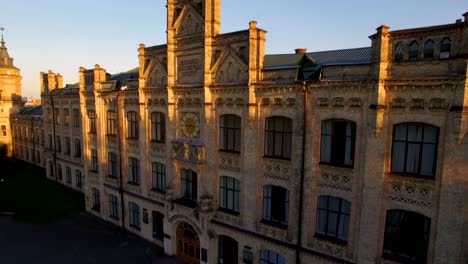 Old-colledge-on-the-background-of-the-city-at-sunset-aerial