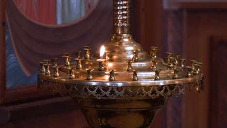 A-small-candle-in-a-Church-candlestick