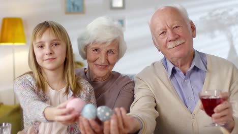 Portrait-of-Girl-and-Grandparents-Celebrating-Easter