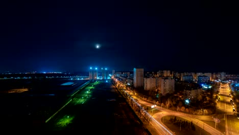 The-moon-above-the-night-city.-time-lapse