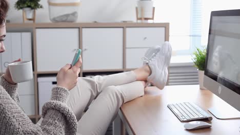 Young-Woman-Procrastinates-Scrolling-her-Smartphone