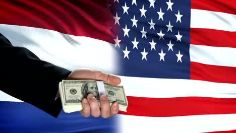 Netherlands-and-USA-officials-exchanging-tank-money,-flag-background,-politics