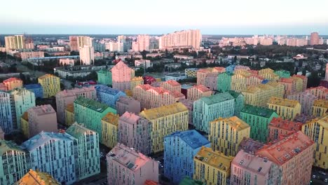 Flying-over-cozy-comfortable-colorful-buildings-in-a-European-city,-aerial-survey