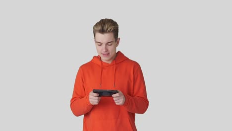 Excited-man-playing-game-on-mobile-phone