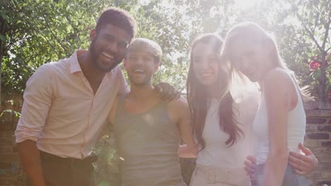 Portrait-Of-Male-And-Female-Gay-Friends-At-Home-In-Garden-Against-Flaring-Sun-Together