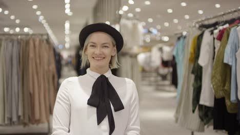 Happy-Woman-Posing-in-Clothing-Store