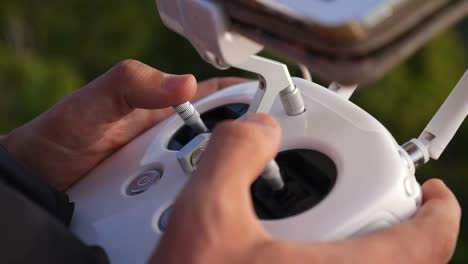 Hands-Operating-Drone-Remote-Controller-with-Joystick