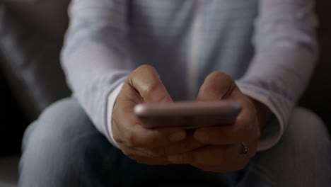 Close-up-woman-hands-texting-message-on-mobile-smart-phone-for-communication.