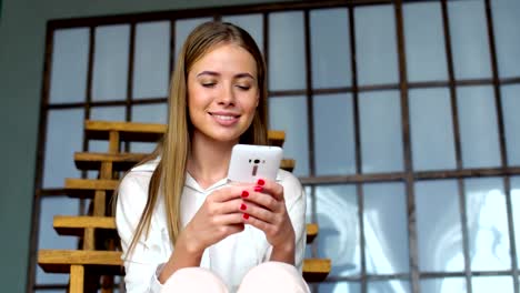 Young-girl-use-cellphone-for-browsing-social-networks-or-messaging-online