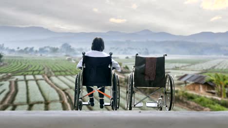 Elderly-woman-with-empty-wheelchair-standing-together