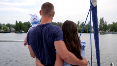 husband-and-wife-with-small-kid-on-yacht,-family-travel,-mum,dad-and-son-in-open-air,-happy-parents-with-child-on-rest