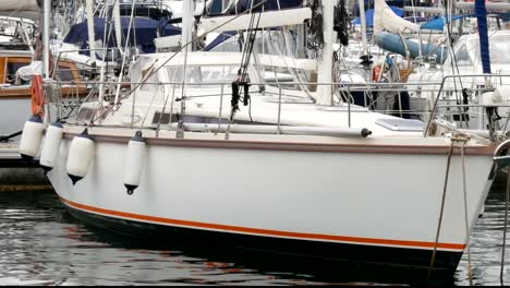 Part-of-beautiful-white-stylish-yacht-moored-in-a-harbor-or-bay-in-Barcelona