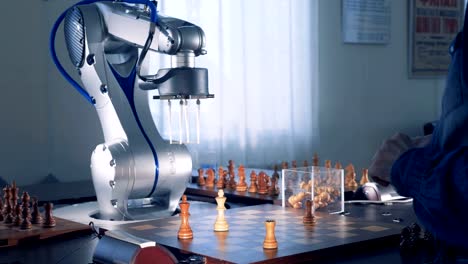 Robot-and-a-chess-player-playing-chess.