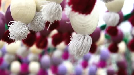 Easter-wooden-garland-with-painted-eggs.