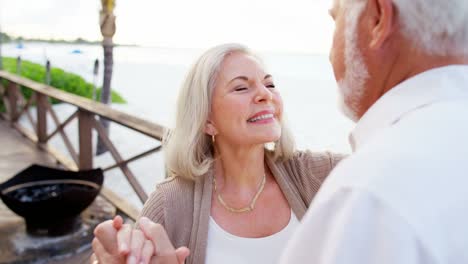 Mature-Caucasian-couple-dancing-on-a-tropical-vacation