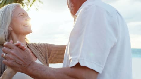 Loving-retired-Caucasian-couple-dancing-at-vacation-resort