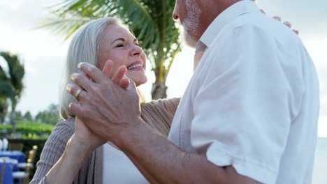 Retired-Caucasian-couple-evening-dancing-at-vacation-hotel