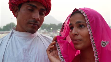 Pan-to-closeup-beautiful-Indian-bride-and-handsome-husband--in-Pushkar,-India