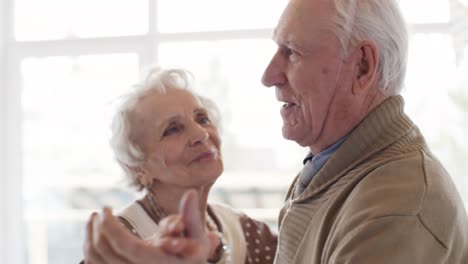 Loving-Elderly-Couple-Dancing-at-Party