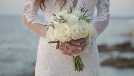 Bride-holding-a-wedding-bouquet