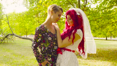 Lesbian-wedding.-The-bride-and-groom-are-hugging-each-other-and-talking