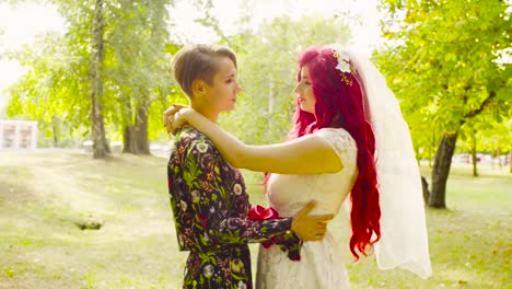 Lesbian-wedding.-The-bride-and-groom-are-hugging-each-other-and-talking