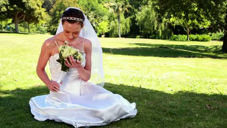 Content-bride-sitting-on-the-grass