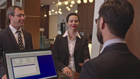 Business-Visitors-at-Hotel-Check-In