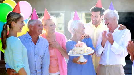Doctors-and-senior-citizen-celebrating-birthday