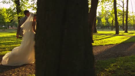 Newlyweds-are-running-in-the-park.