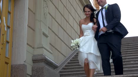 Bride-and-groom-walking-downstairs.