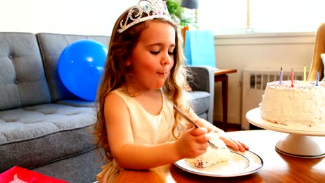 Girl-having-cake-at-home