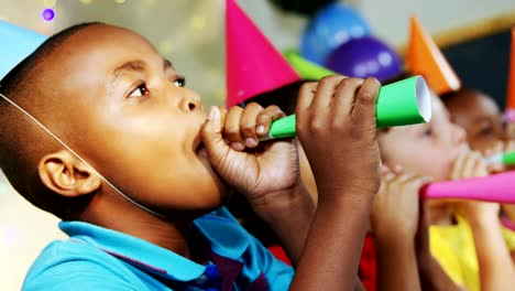 Kids-blowing-party-horns-during-birthday-party-4k